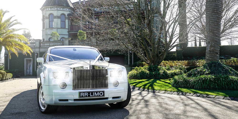 white 10 seater Rolls Royce limousine airport transfer hire - RRL